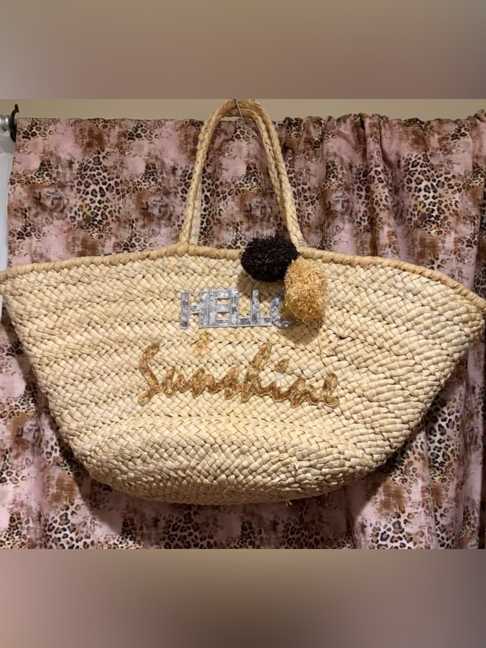 Natural Straw Tote Bag with 'Hello Sunshine' Script and Pom-Pom Accents